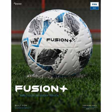 The Precision Training Fusion+ FIFA Basic Training Ball, featuring a durable white and black design with blue accents, rests on green turf. A soccer goal and red fencing blur in the background, highlighting its precision and consistency.