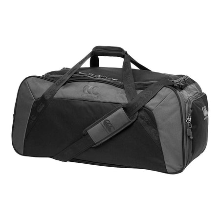 The Canterbury Classic Holdall Bag is a black waterproof gym bag with a zippered main compartment, two side pockets, carrying handles, an adjustable shoulder strap, and features the Canterbury logo.