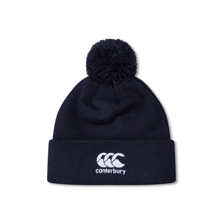 The Canterbury Club Bobble Hat by Canterbury is a navy fleece-lined hat with a pom-pom, folded brim, and white embroidered logo on the front—an ideal winter accessory.