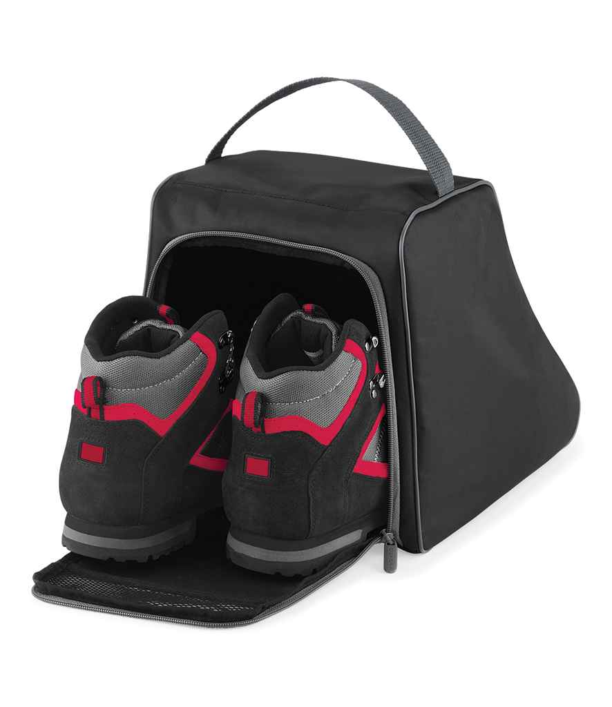 A pair of black and red hiking boots are stored inside an open Quadra Hiking Boot Bag by Quadra, made of black 420D polyester with a zippered closure and a top webbing carry handle, neatly displaying the boots inside.