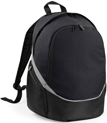 The Quadra Pro Team Backpack by Quadra, in Black/Grey, features a 17-litre capacity, curved grey stripe, two main zippered compartments, padded shoulder straps, and a top handle; shown on a plain white background.