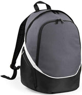 The Quadra Pro Team Backpack by Quadra, in Graphite Grey/Black/White, features a 17L capacity, front zipper pocket, white diagonal accent stripe, wet pocket, and padded shoulder straps. It stands upright against a white background.