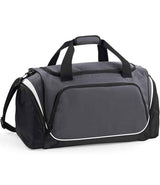 The Quadra Pro Team Holdall by Quadra in Graphite Grey/Black/White features black handles, a shoulder strap, multiple zippered compartments, white trim, a shoe tunnel, and a front pocket—ideal as a 55L gym bag.