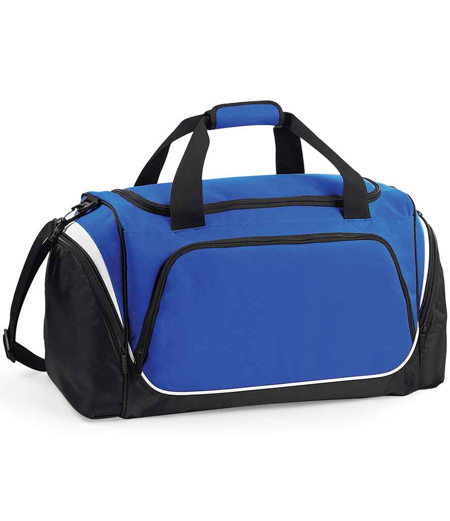 The Quadra Pro Team Holdall by Quadra is a 55L gym bag in Royal Blue/Black/White, featuring black handles, a shoulder strap, multiple zippered compartments, a large front pocket, white piping accents, and a dedicated shoe tunnel.
