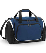 The Quadra Pro Team Locker Bag by Quadra in French Navy/White features a large front zip pocket, two top handles with padded grip, an adjustable shoulder strap, and white piping accents—ideal for keeping gym essentials organized.