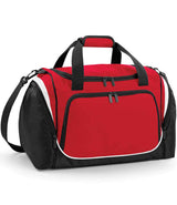 The Quadra Pro Team Locker Bag by Quadra comes in red, black, and white with black handles, a shoulder strap, large front zippered pocket, side compartments, and a shoe tunnel for organization.