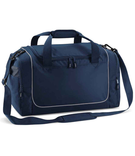 The Quadra Teamwear Locker Bag by Quadra in French Navy/Light Grey features black zippers, a front zip pocket, dual padded handles, side mesh pocket, 30L capacity, and an adjustable shoulder strap.