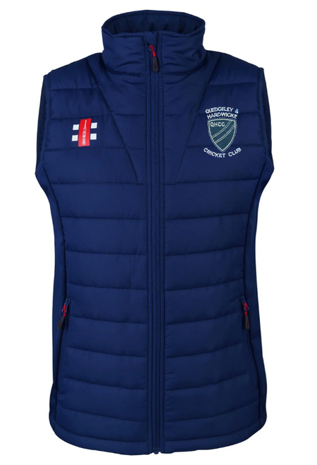 The Gray Nicolls Quedgeley & Hardwick CC Pro Performance Bodywarmer is a navy blue, sleeveless padded vest with a high collar, zip front, side zip pockets, club logo, and England flag patch on the chest.