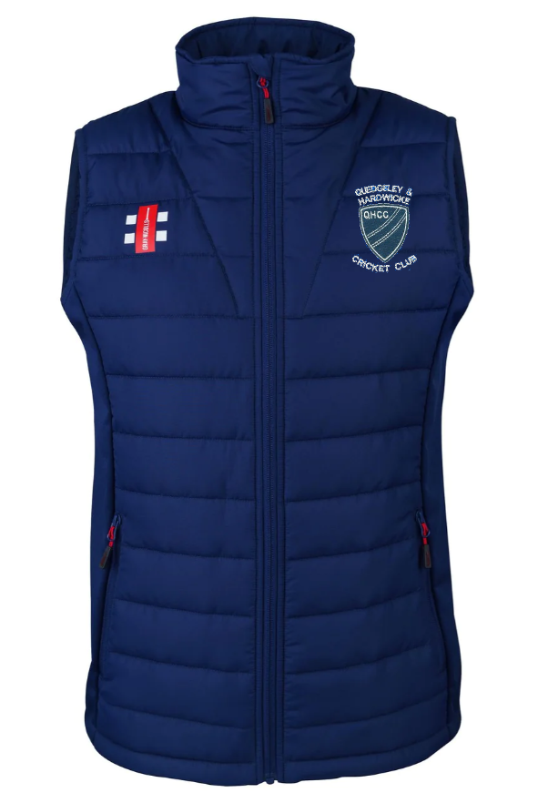 The Gray Nicolls Quedgeley & Hardwick CC Pro Performance Bodywarmer is a navy blue, sleeveless padded vest with a high collar, zip front, side zip pockets, club logo, and England flag patch on the chest.