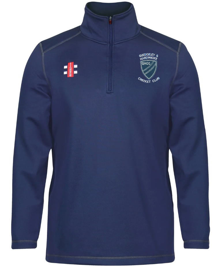 The Gray Nicolls Quedgeley & Hardwicke CC Thermo Fleece is a navy long-sleeve quarter-zip stretch pullover with white stitching, featuring the club shield logo on the left chest and a red and white emblem on the right.