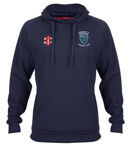 The Gray Nicolls Quedgeley & Hardwicke CC Velocity Hoodie is a navy active fit hoodie with drawstrings, long sleeves, a front pocket, a red and white emblem on the right chest, and the blue and white Cricket Club logo on the left.