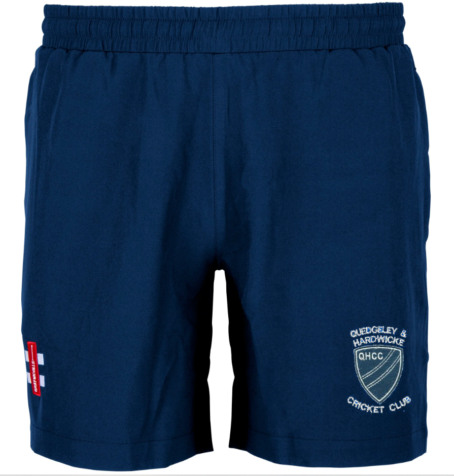 The Quedgeley & Hardwicke CC Training Shorts by Gray Nicolls are navy blue with an elastic waistband, the club logo on the right leg, and a red and white patch on the left—ideal for cricket training.