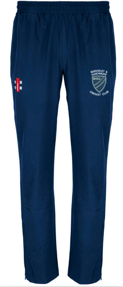 The Gray Nicolls Quedgeley & Hardwicke CC Velocity Track Trousers are navy blue with an elastic waistband, a red and white England flag on the right thigh, and the club crest on the left—ideal for cricket training.