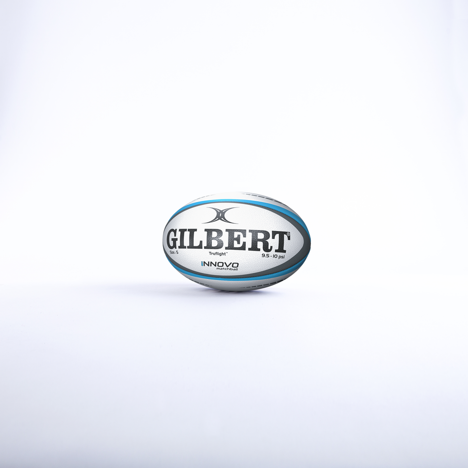 A Gilbert Innovo Match Ball (Size 5) in white with blue and black accents, branded "Gilbert," is centered on a white background.