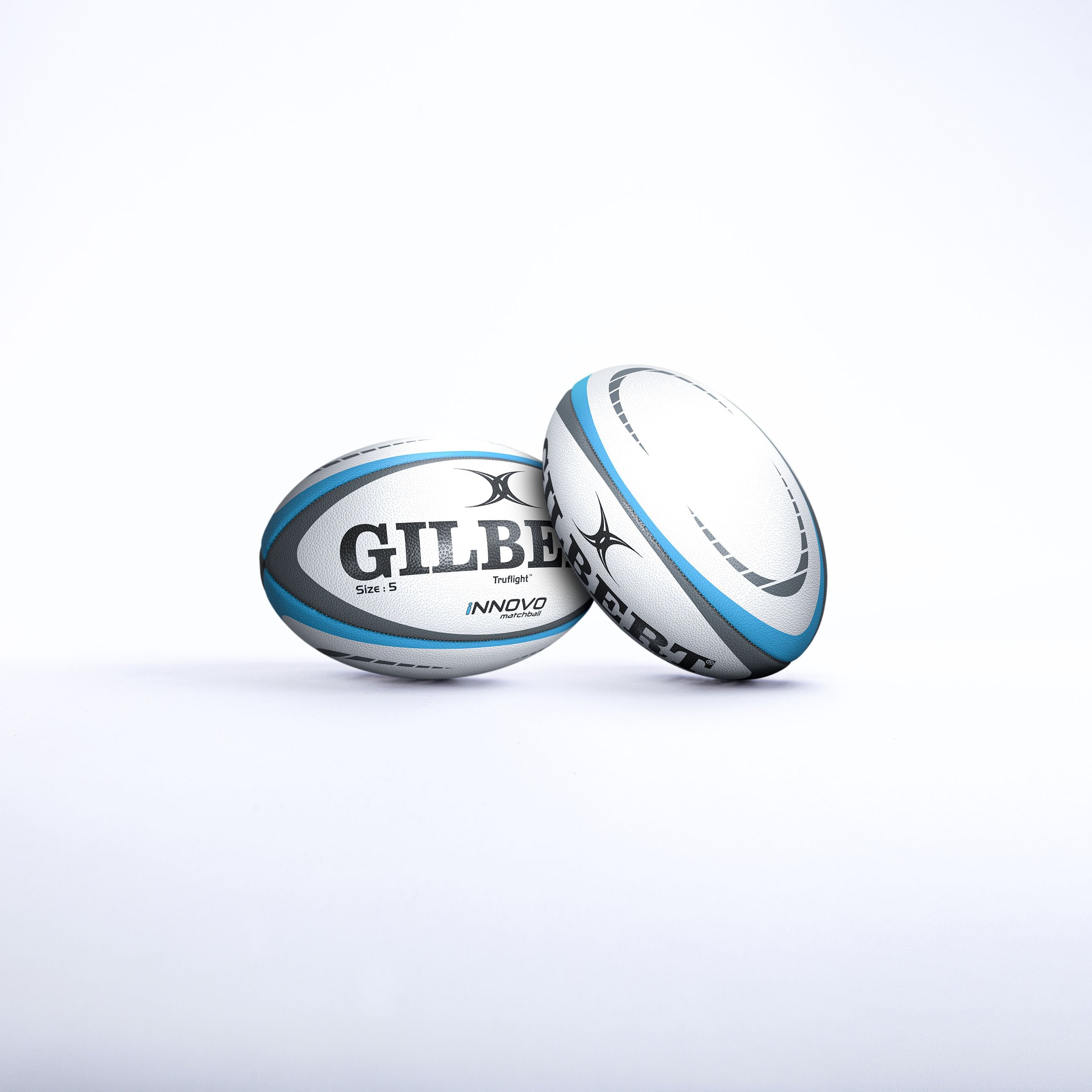 Two Gilbert Innovo Match Balls (Size 5) by Gilbert, white and blue, are displayed on a plain white background—one upright and one lying on its side with the logo clearly visible.