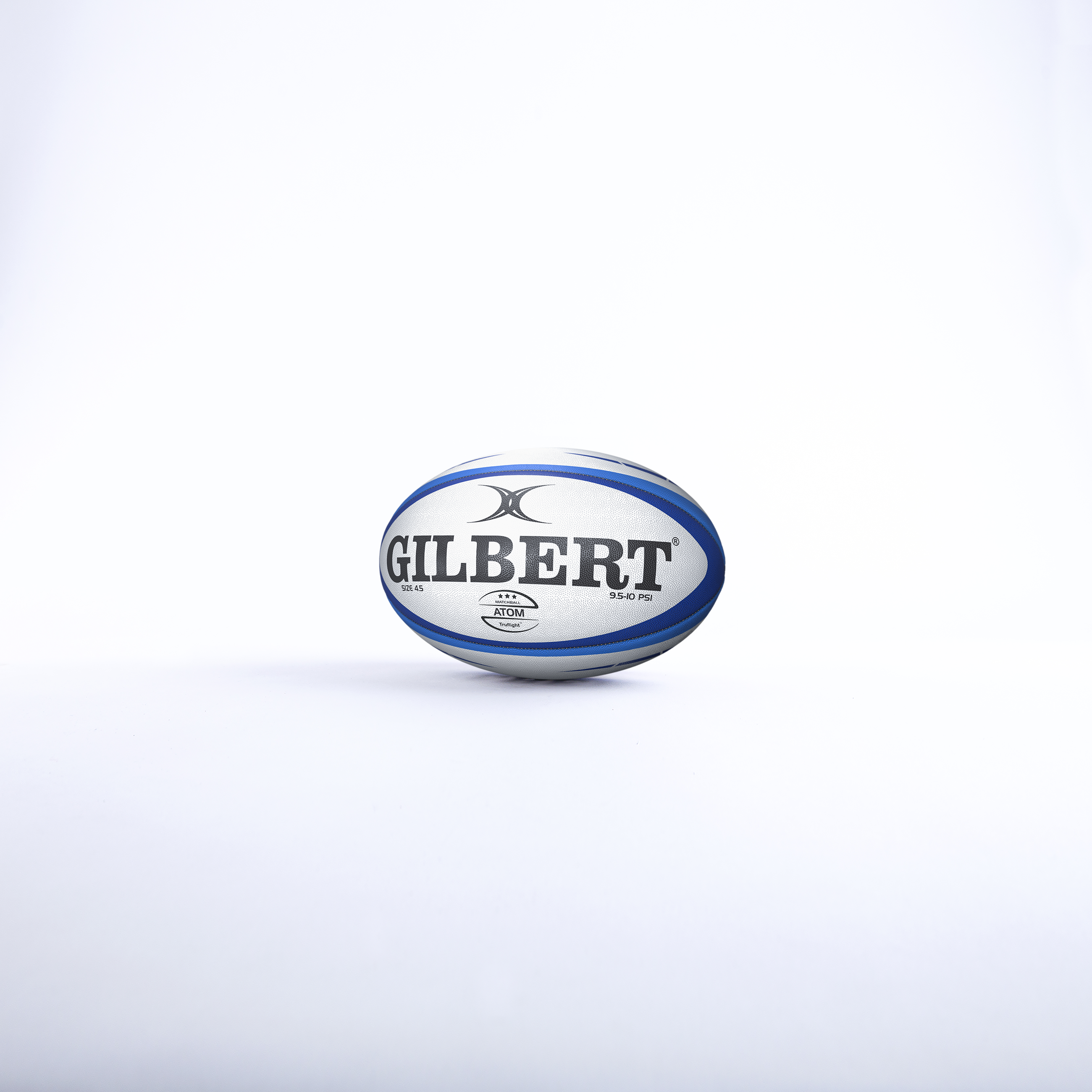 The Gilbert Atom Match Ball, in white and blue, stands upright on a plain white background, reflecting the renowned quality of Gilbert rugby balls.