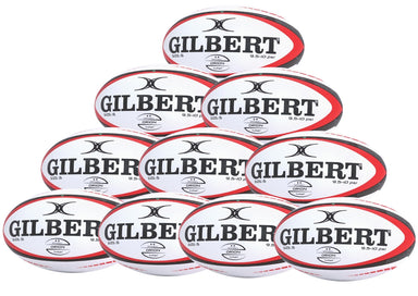 Ten Gilbert Orion Match Rugby Balls in black/red are stacked in a pyramid, each featuring the GILBERT brand and logo—ideal for your next match. Available as a convenient ten-pack.