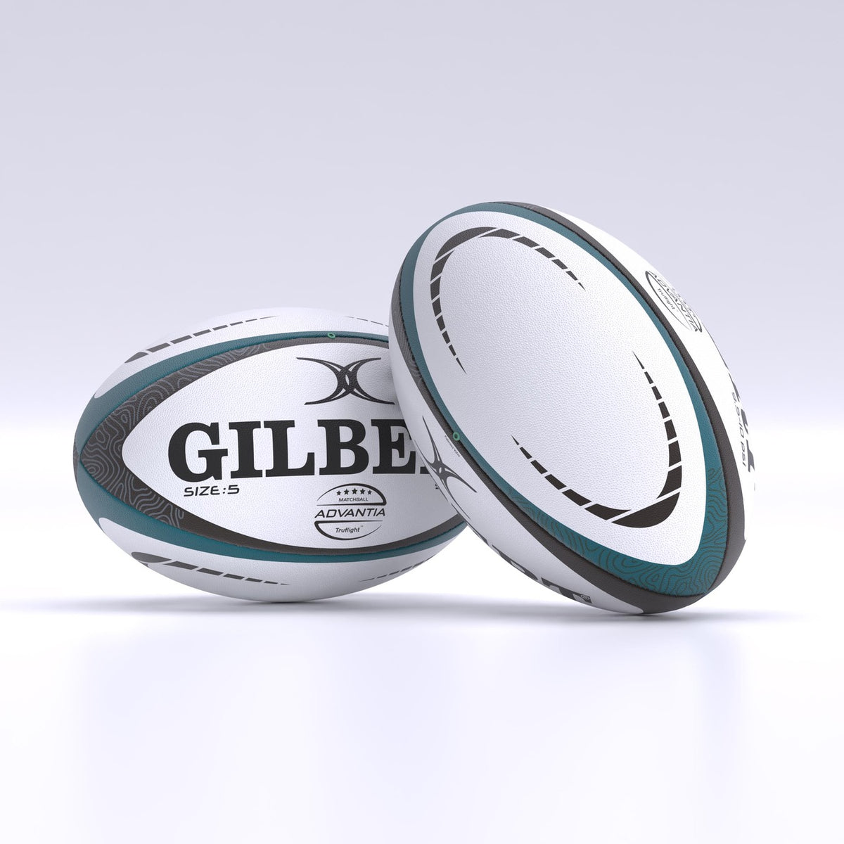 Two white and teal Gilbert Advantia Match Rugby Balls with black and gray patterns rest on a white surface. One hand-stitched ball lies flat, showing the Gilbert name, while the other stands upright, displaying its side.