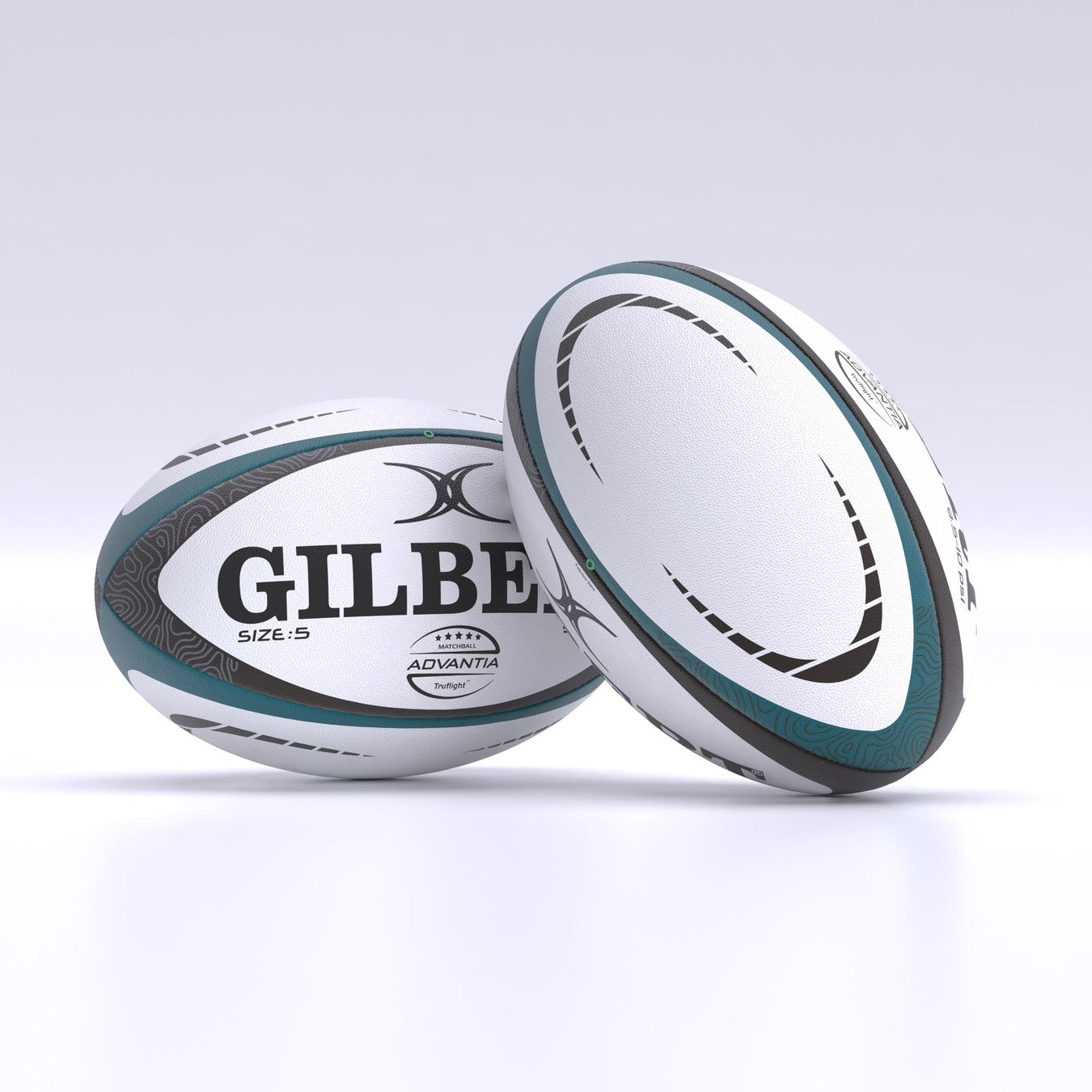 Two white and teal Gilbert Advantia Match Rugby Balls with black and gray patterns rest on a white surface. One hand-stitched ball lies flat, showing the Gilbert name, while the other stands upright, displaying its side.