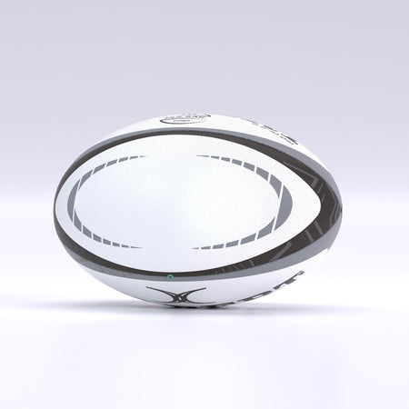 The Gilbert Pulsar Match Rugby Ball by Gilbert, in white with black and gray curved patterns and hand-stitched to World Rugby standards, stands upright on a smooth, light surface against a softly lit, neutral background.