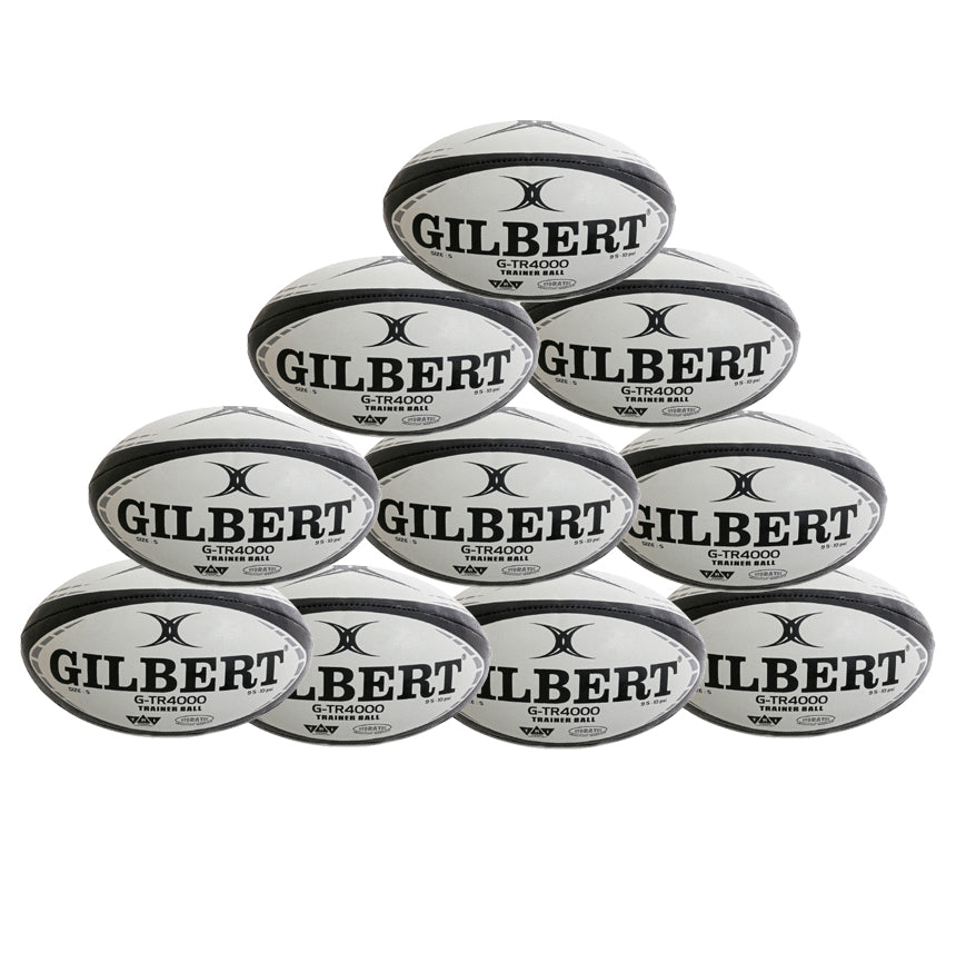 Ten black Gilbert G-TR4000 Rugby Balls from Gilbert are stacked in a pyramid shape against a white background, each branded with “GILBERT” and featuring Tri Grip Technology. Available as a convenient ten pack.