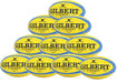 A pyramid stack of ten fluro Gilbert G-TR8000 Training Rugby Balls, each showing the brand and model, ideal for UK rugby enthusiasts or training sessions.