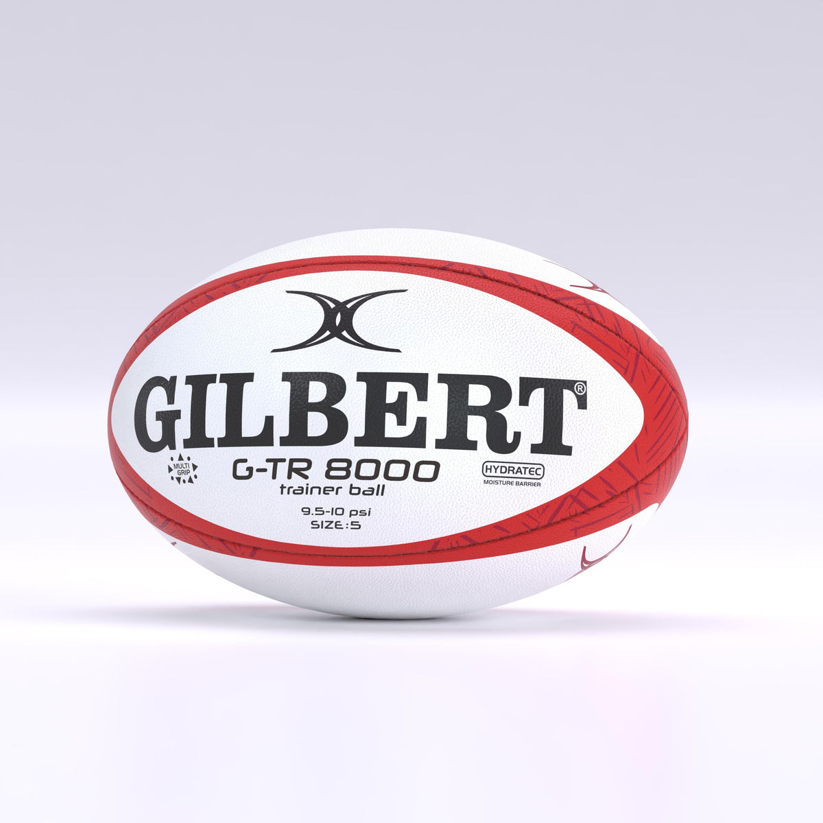 A red Gilbert G-TR8000 Training Rugby Ball is displayed on a plain, light-gray background. The durable rubber ball features black and red branding, as well as size and pressure details printed on its surface.