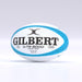 A sky blue Gilbert G-TR8000 Training Rugby Ball rests on a white background, displaying the Gilbert brand, model name, and size 5 markings.