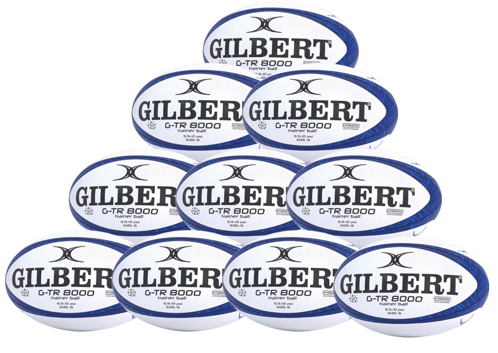 Ten navy Gilbert G-TR8000 Training Rugby Balls from the Gilbert brand are stacked in a pyramid, each displaying the logo—an ideal set for any UK rugby enthusiast.