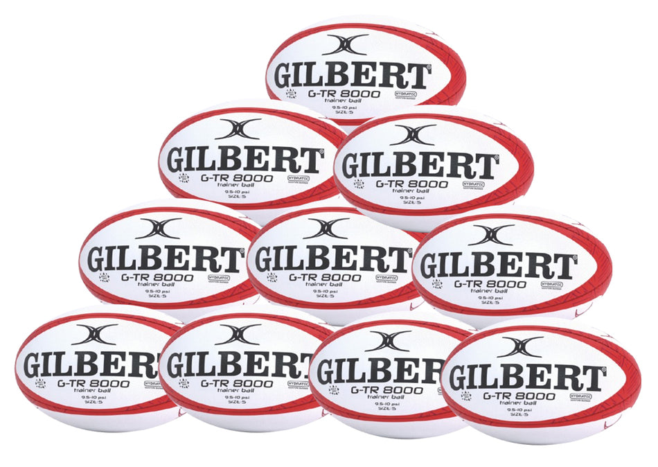 A pyramid stack of ten red Gilbert G-TR8000 Training Rugby Balls, each featuring the brand name in bold, ideal for clubs seeking a reliable UK rugby ball option.