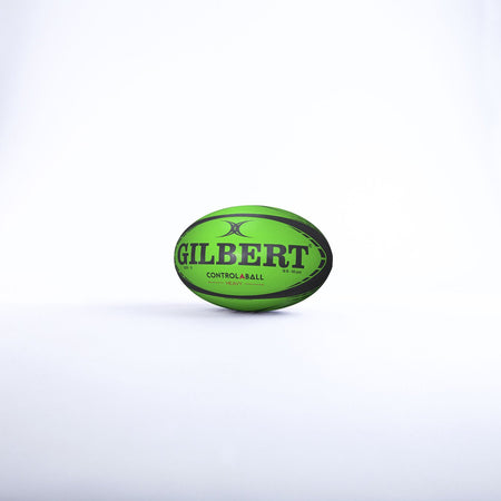 A green Gilbert Control-A-Balls - Singles rugby ball with black text, from the Gilbert training range, stands upright on a white background.