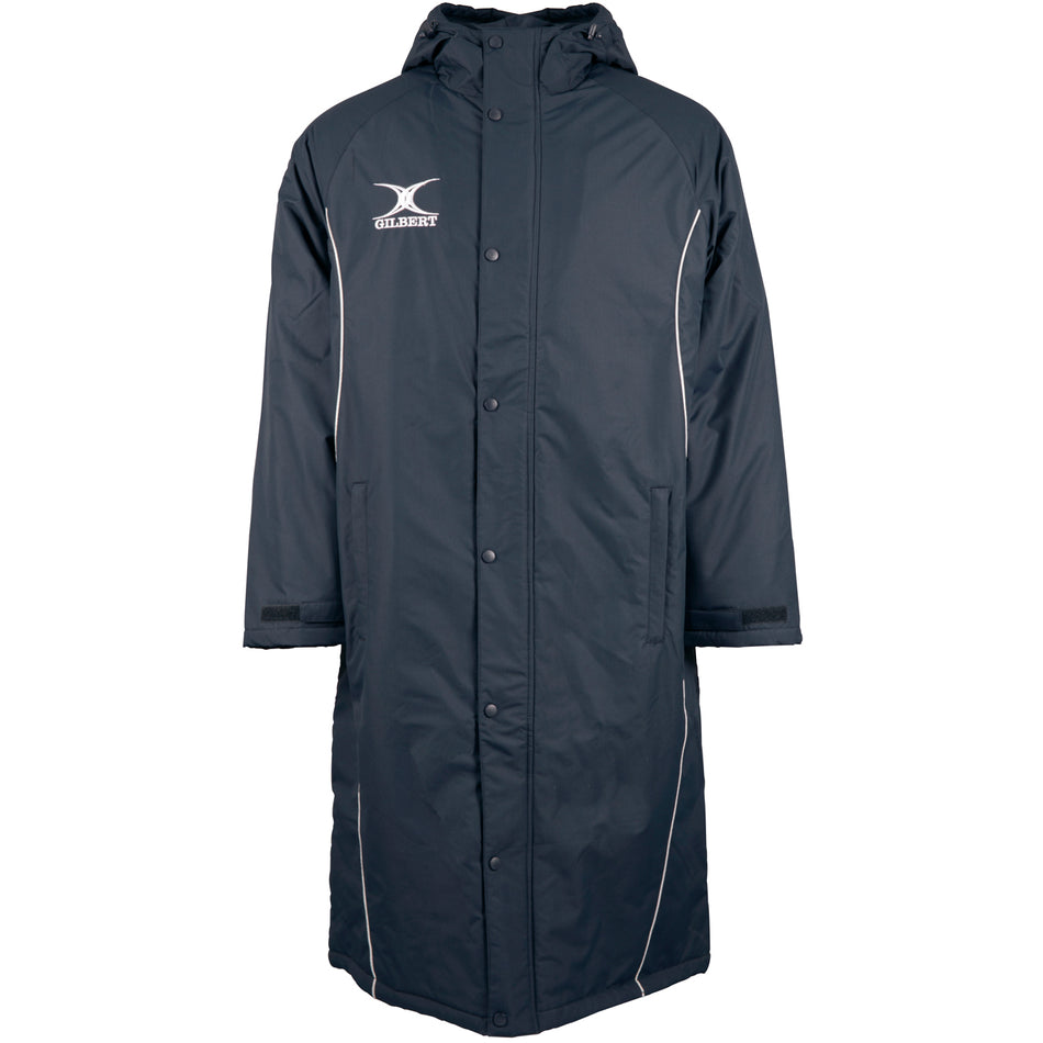 The Gilbert Touchline Sub Jacket by Gilbert is a long, dark waterproof jacket with a hood, button closure, white piping, and an ODIN AQUATIC fish logo—perfect for outdoor wear and inspired by classic touchline style.