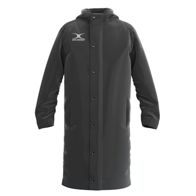 The black Gilbert TTS Touchline Jacket is a waterproof coat with a hood, snap-button front, two side pockets, and the Gilbert logo on the upper left chest—perfect for comfort in wet weather.