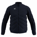 The Gilbert GTS Full Zip Jacket by Gilbert comes in dark navy, featuring long sleeves, padded design, a front zipper, high collar, diagonal stitching for style and warmth, and a small white logo on the left chest.
