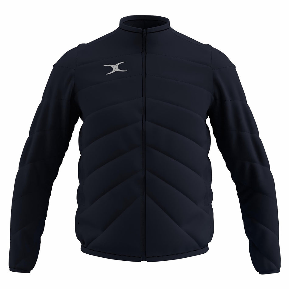 The Gilbert GTS Full Zip Jacket by Gilbert comes in dark navy, featuring long sleeves, padded design, a front zipper, high collar, diagonal stitching for style and warmth, and a small white logo on the left chest.