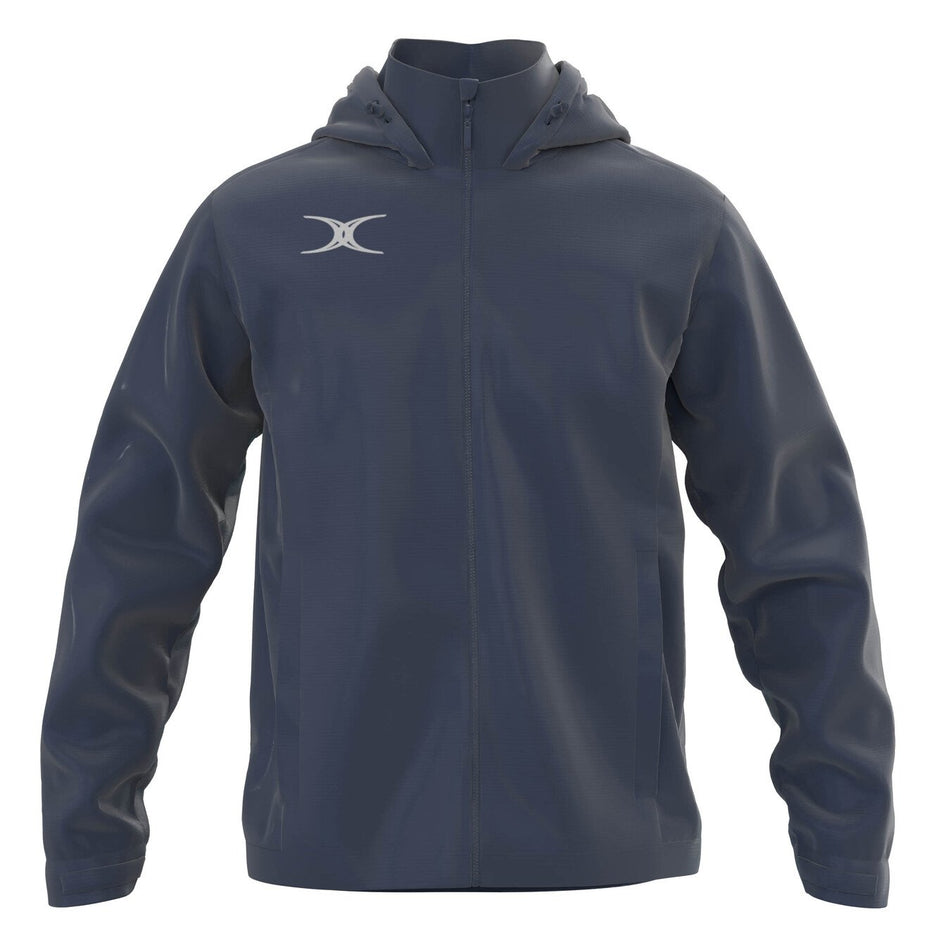 The Gilbert TTS Rain Jacket by Gilbert is a dark gray hooded jacket featuring a full front zipper, long sleeves, two side pockets, and a white crescent logo on the left chest.