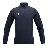The Gilbert Atom 1/4 Zip Jacket by Gilbert is a navy blue lightweight outerwear piece made from recycled polyester, with long sleeves, high collar, two side zip pockets, and a white abstract chest logo.