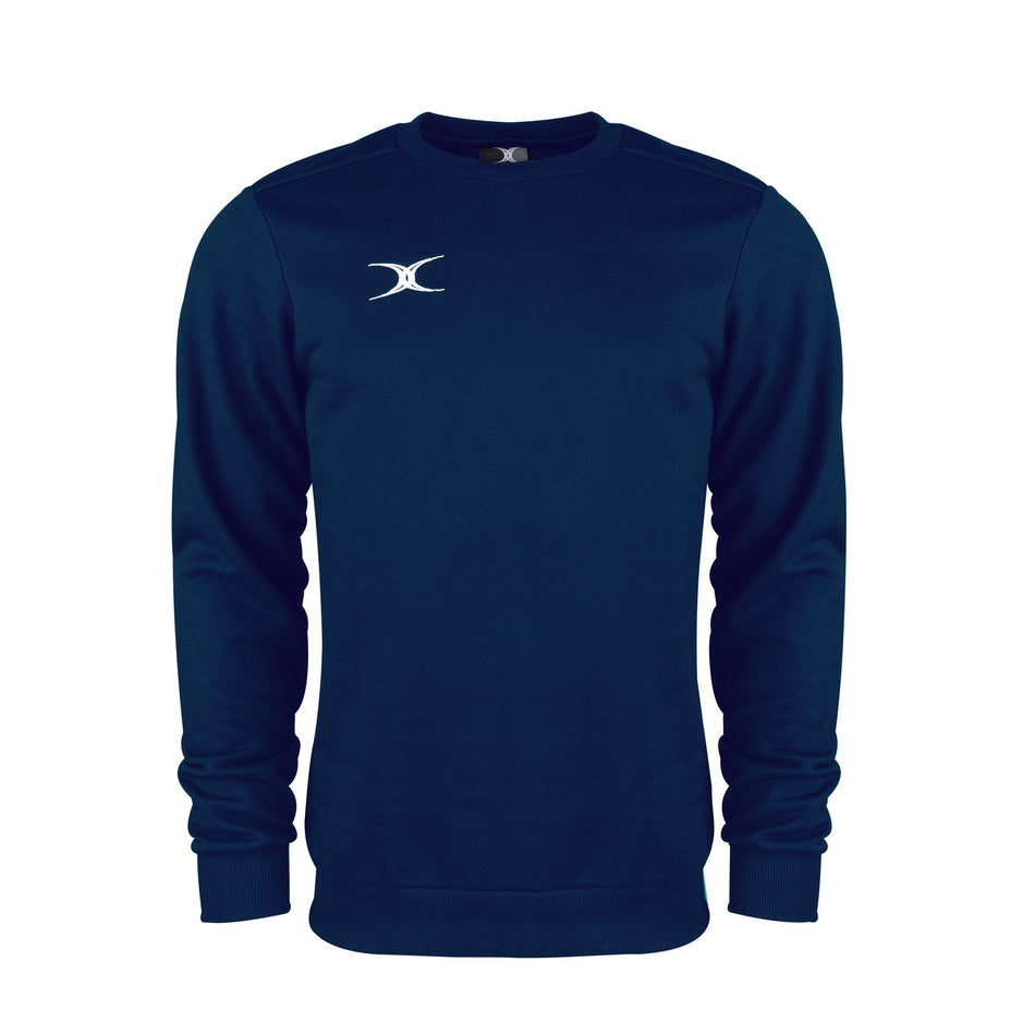 The Gilbert Atom Sweatshirt by Gilbert is a navy blue long-sleeve crewneck made from soft cotton fleece, featuring ribbed cuffs, hem, and a small white logo on the left chest. Displayed against a plain white background.