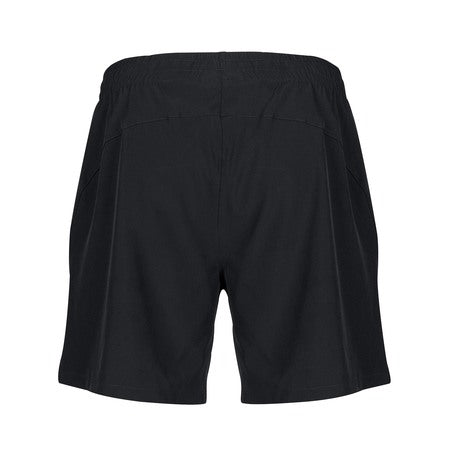 The Gilbert Photon Rugby Shorts Women by Gilbert are black, female-specific sports shorts shown from the back with an elastic waistband, relaxed fit, and lightweight design. No logos, patterns, or pockets are visible on this side.