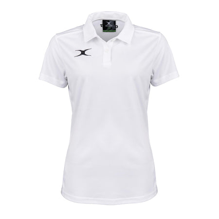 The Gilbert Womens Photon II Polo Shirt is a white short-sleeve performance polo with a collar, three buttons, and small black Gilbert logos on the left chest and inside the collar, shown against a white background.