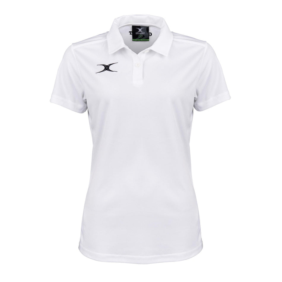 The Gilbert Womens Photon II Polo Shirt is a white short-sleeve performance polo with a collar, three buttons, and small black Gilbert logos on the left chest and inside the collar, shown against a white background.