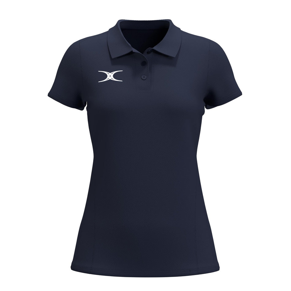 The Gilbert Atom Polo - Womens by Gilbert is a navy blue casual polo featuring short sleeves, a collar, three buttons, and a white left chest logo. Made from recycled polyester with moisture wicking, it’s shown on a plain white background.