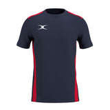 The Gilbert Atom Tee Shirt by Gilbert features dark navy and red colors, short sleeves, moisture-wicking fabric, red side panels and shoulder accents, and a white stylized logo on the left chest. Displayed on a plain white background.