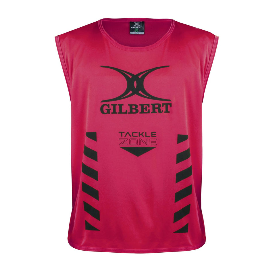 The Gilbert Tackle Zone Bib is a sleeveless red rugby training bib with "GILBERT" and "TACKLE ZONE" printed in black, black chevron stripes on both sides, and a large black logo—perfect for practicing tackle height regulations.