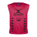 The Gilbert Tackle Zone Bib is a sleeveless red rugby training bib with "GILBERT" and "TACKLE ZONE" printed in black, black chevron stripes on both sides, and a large black logo—perfect for practicing tackle height regulations.