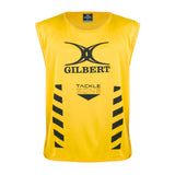 The Gilbert Tackle Zone Bib is a sleeveless yellow rugby training bib with "GILBERT" and "TACKLE ZONE" printed in black, black chevrons on the sides, and a black logo—ideal for practicing tackle height regulations.
