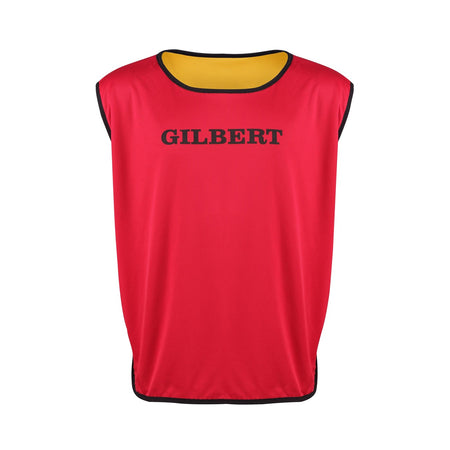 The Gilbert Rugby Reversible Training Bib by Gilbert features a red exterior with black trim, bold GILBERT chest print, and a yellow inner lining—perfect for adult team sessions. Shown against a plain white background.