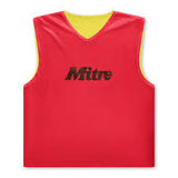 The Mitre Reversible Training Bib features a red exterior and yellow interior, with the Mitre brand name printed in black on the front.