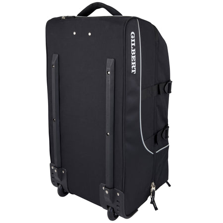 The Gilbert Club Tour Wheeled Holdall features a black design with wheels, top handle, reinforced corners, protective rails, and "GILBERT" branding—ideal as a spacious sports bag for athletes on the move.