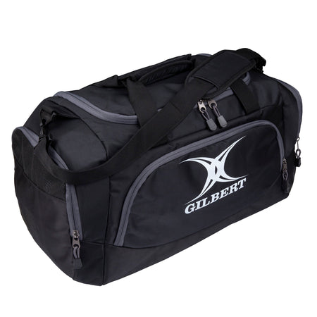 The Gilbert V3 Club Player Holdall is a black sports kit bag with multiple zippered compartments, sturdy shoulder straps, and the GILBERT logo on the front—perfect for carrying your Gilbert gear.